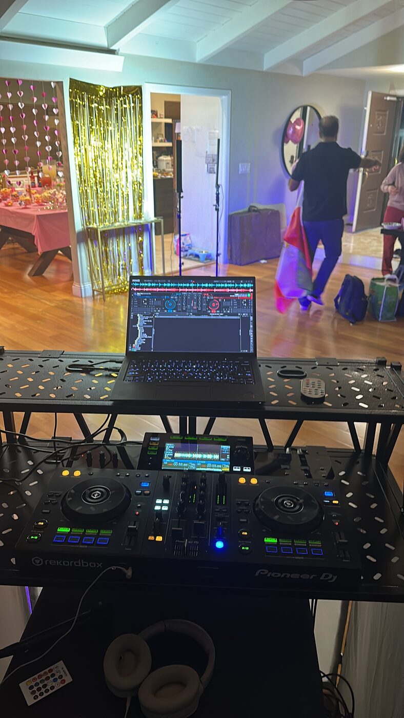 DJ Alphire's Pioneer XDJ setup in a large event hall