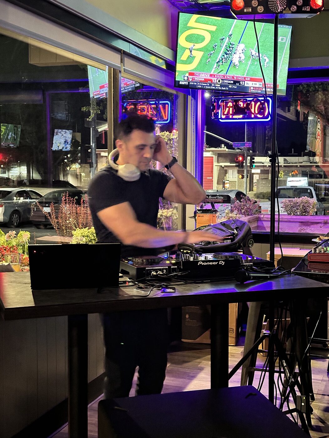 DJ Alphire with tambourine performing at a private house party